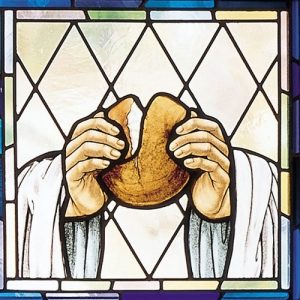 Stained Glass Window of A Man Breaking Bread